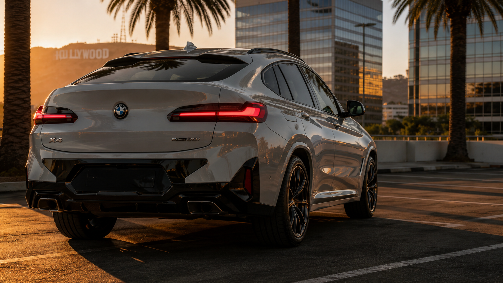 Rear three-quarter BMW X4 portrait at sunset
